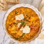 instant pot lentil soup served in bowl topped with parmesan and parsley