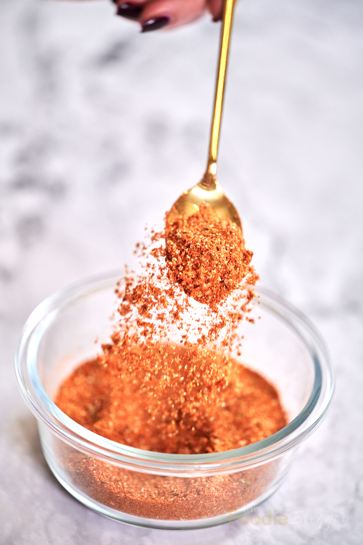 thefoodieblogger homemade taco seasoning blend in a spoon