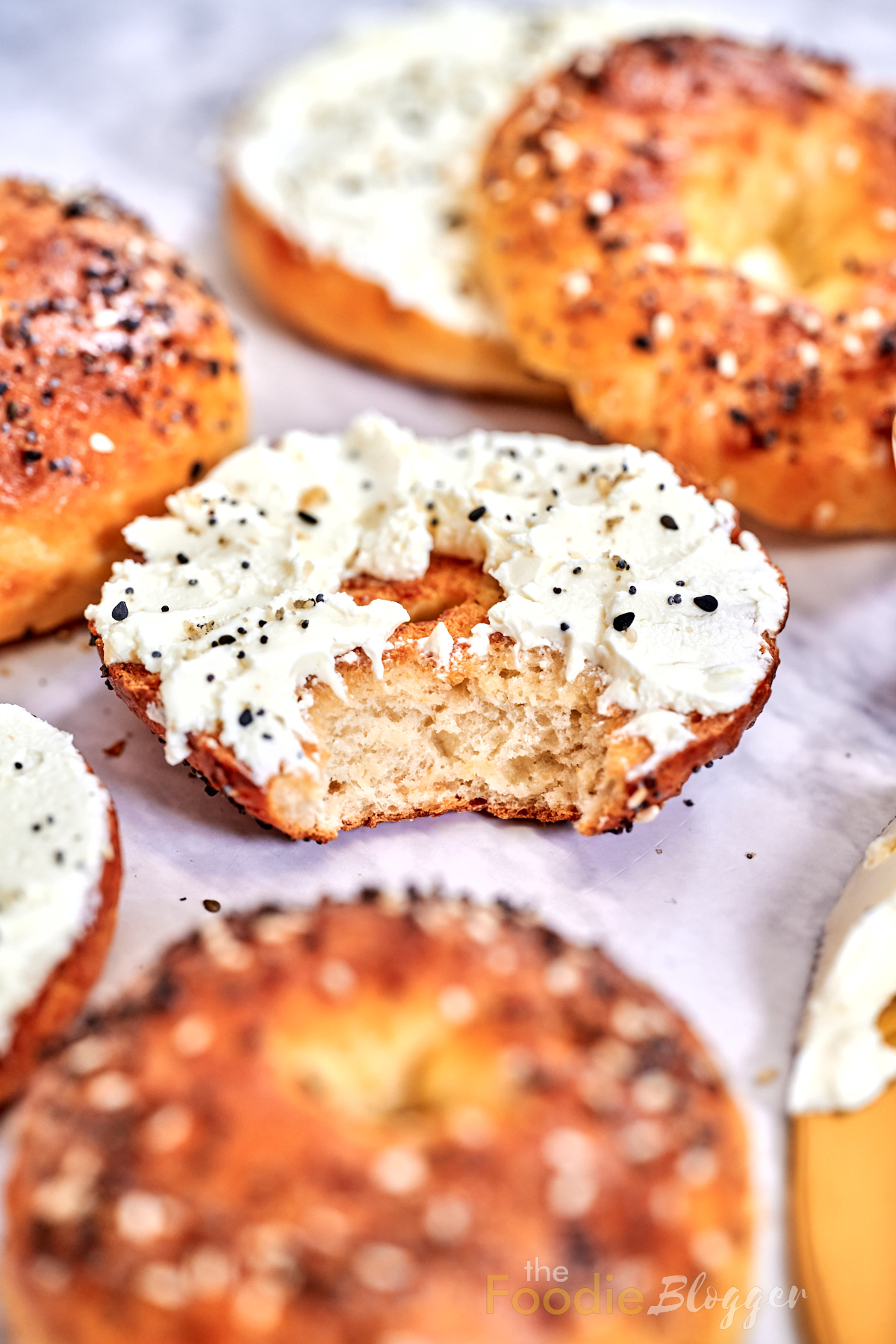 2 ingredients bagels topped with cream cheese and seasoning