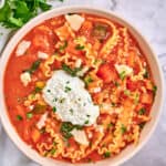 vegetarian lasagna soup in a bowl topped with ricotta cheese blend