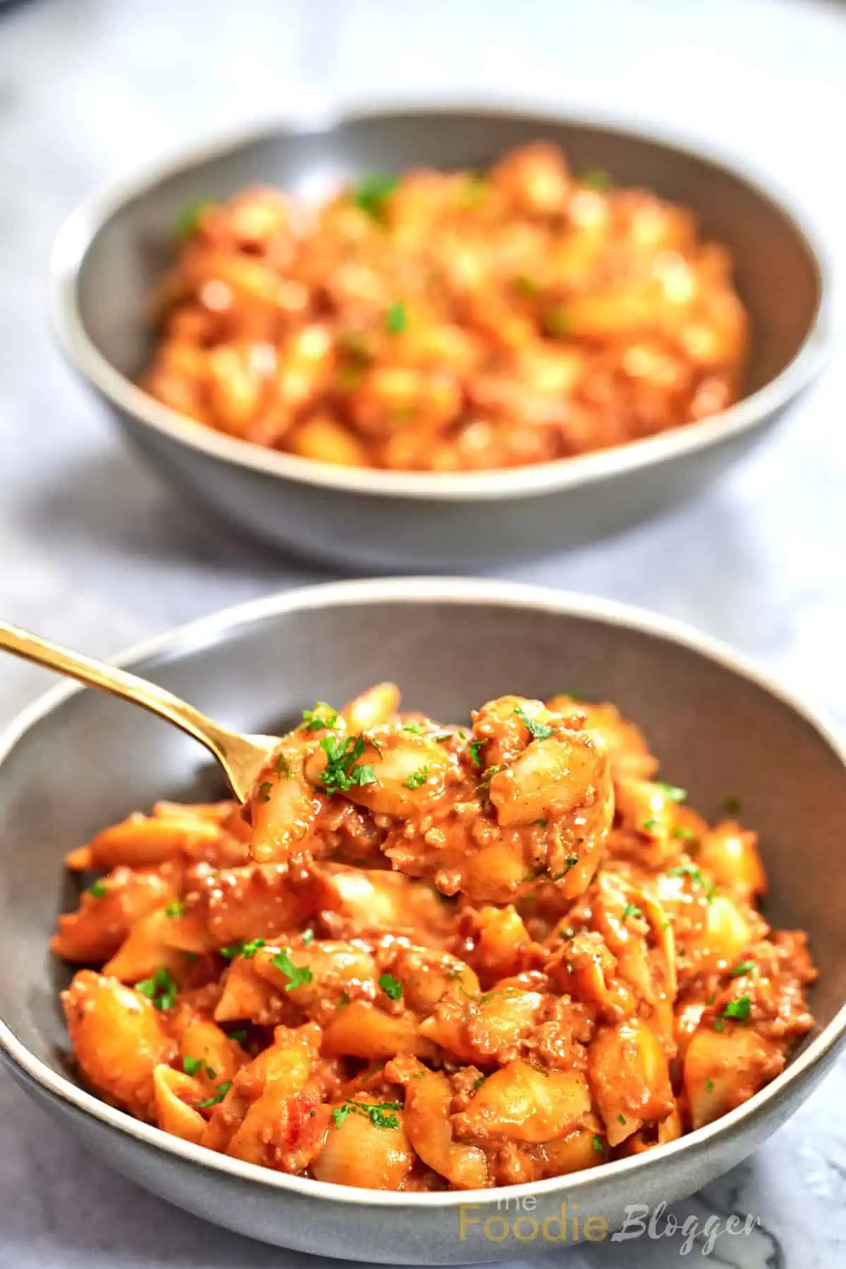 Cheesy Taco Pasta (One Pot) 9 Creamy taco pasta garnished with parsley, highlighting melted cheese and tender noodles.