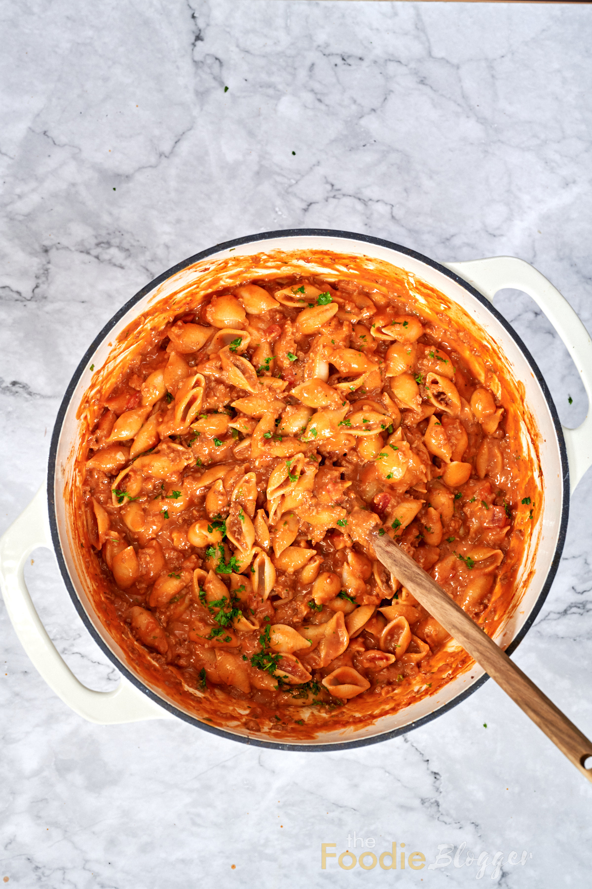 Cheesy Taco Pasta (One Pot) 10 Cooked pasta shells blended with seasoned beef, tomatoes and melted cheese in a single pot.