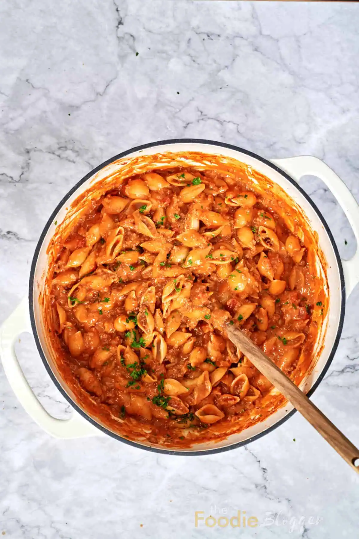 Cheesy Taco Pasta (One Pot) 10 Cooked pasta shells blended with seasoned beef, tomatoes and melted cheese in a single pot.