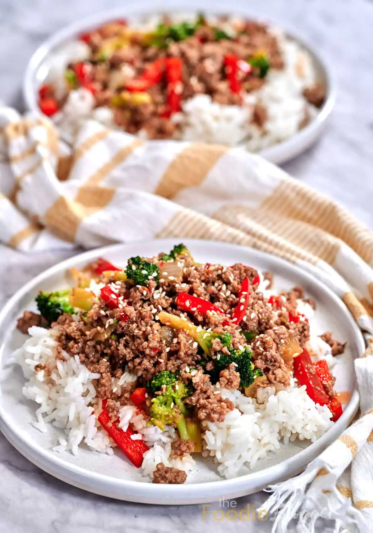 Ground Beef And Broccoli Stir Fry 4 Beef and vegetable stir-fry spooned over fluffy white rice for a complete meal.