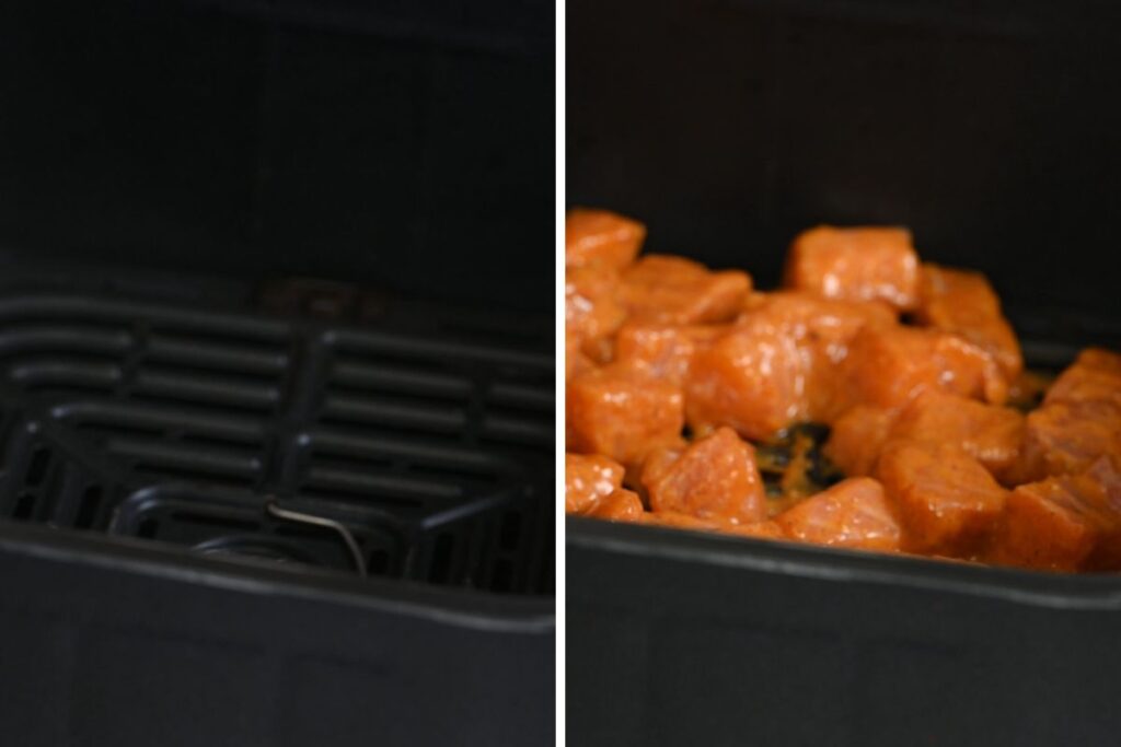 Bang Bang Salmon 5 Marinated salmon cubes arranged in an air fryer basket ready to cook.