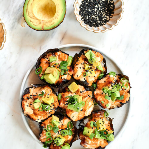 Baked Salmon Sushi Cups 14 Overhead view of baked salmon sushi cups topped with avocado and sesame seeds.