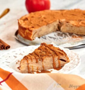 Single serving of apple layer cake showing tender apple slices inside.