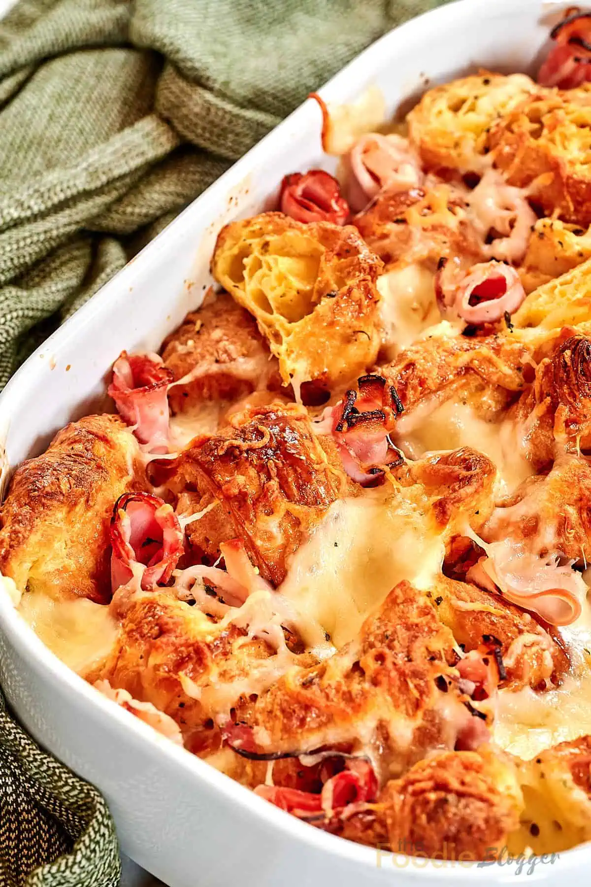 Ham and Cheese Croissant Breakfast Bake 2 Baked croissant casserole with ham, eggs, and melted cheese