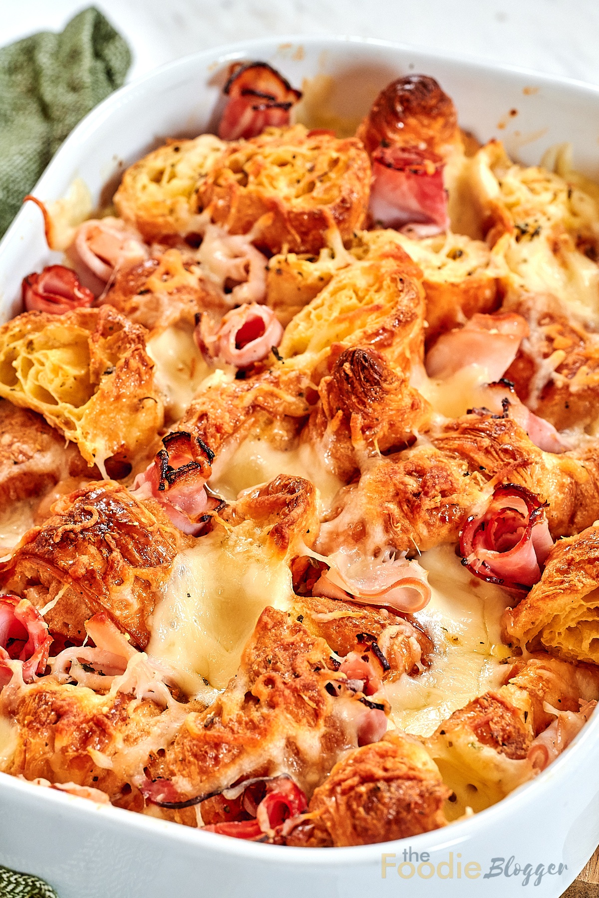 Ham and Cheese Croissant Breakfast Bake 13 Close-up of baked croissant casserole with eggs and ham