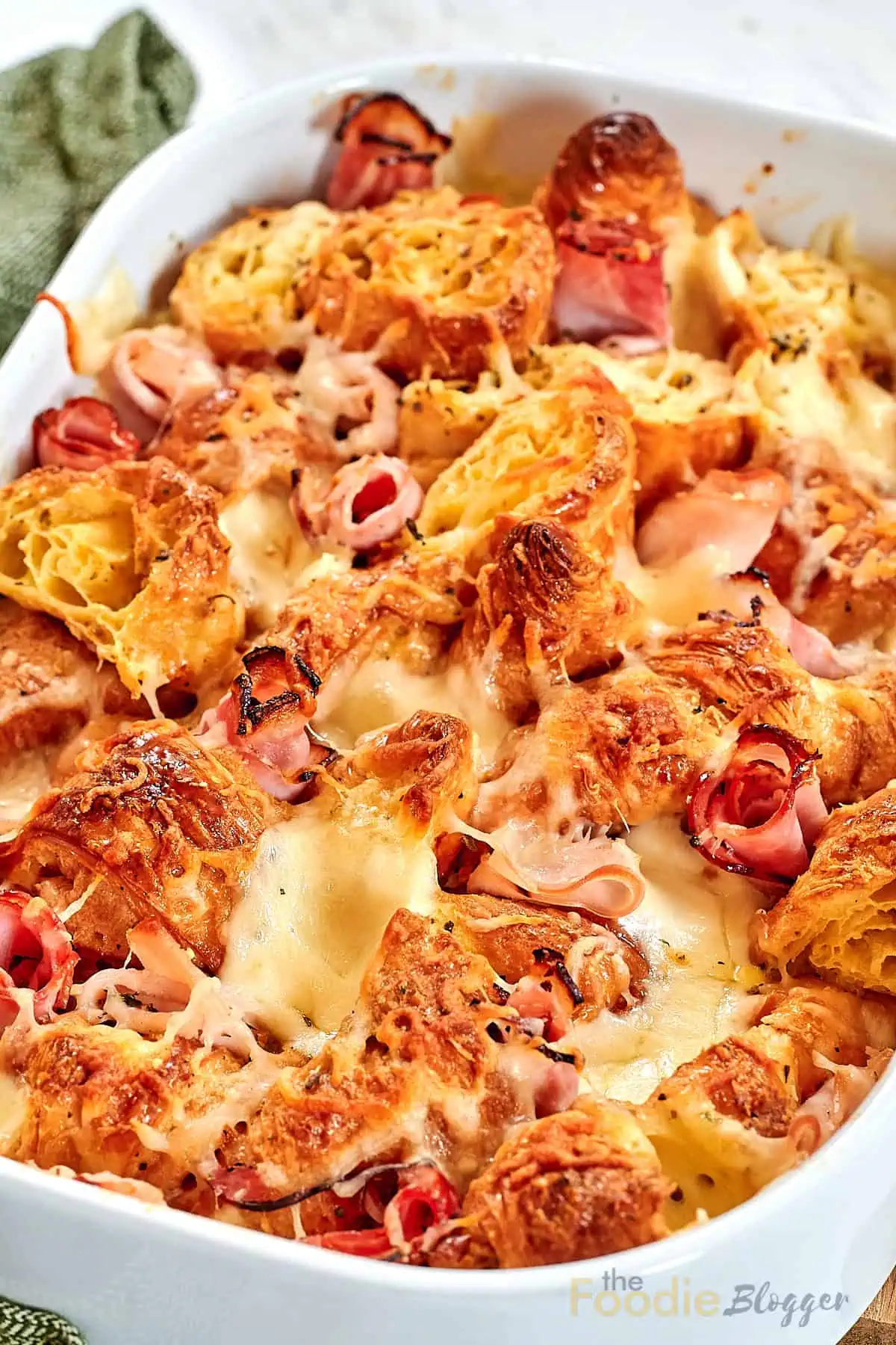Ham and Cheese Croissant Breakfast Bake 13 Close-up of baked croissant casserole with eggs and ham