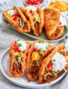 Homemade Taco Bell chalupas filled with seasoned beef, cheese, and sour cream