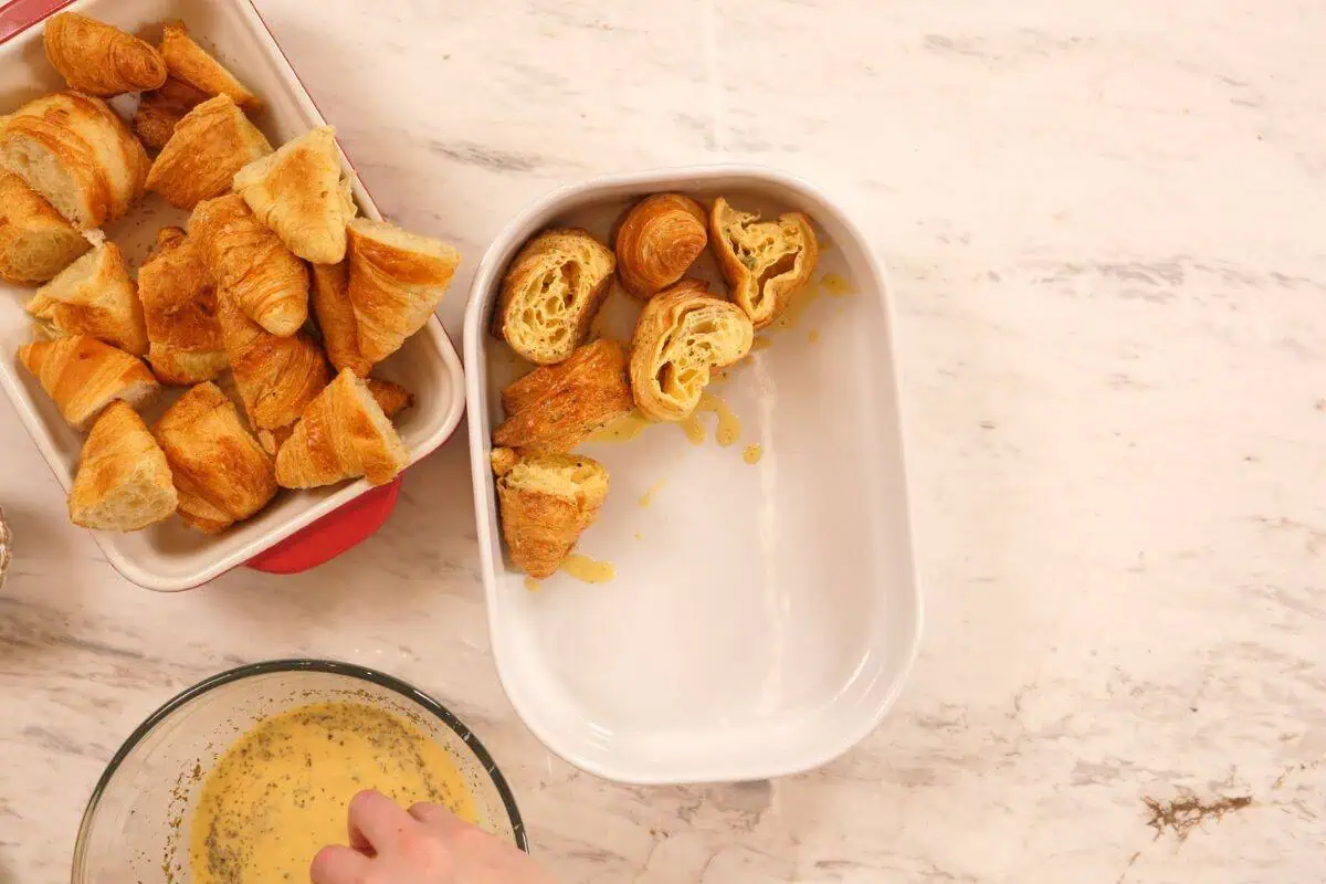 Ham and Cheese Croissant Breakfast Bake 7 Croissant pieces arranged in baking dish