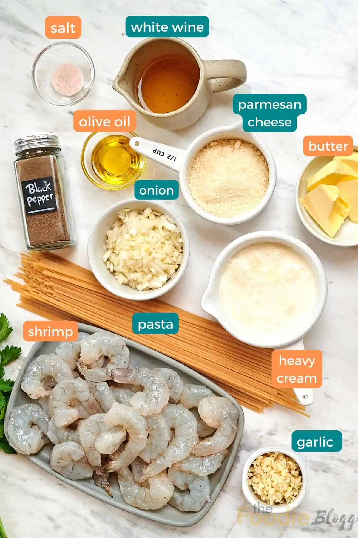 Ultra Creamy Garlic Parmesan Shrimp Pasta 3 Ingredients for ultra creamy garlic parmesan shrimp pasta including raw shrimp, spaghetti, heavy cream, parmesan cheese, butter, garlic, onion, broth, olive oil, and fresh parsley