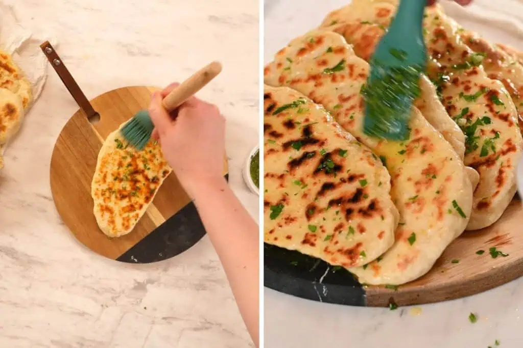 2-Ingredient Garlic Butter Naan 10 Brushing warm homemade naan with garlic butter on a wooden serving board.